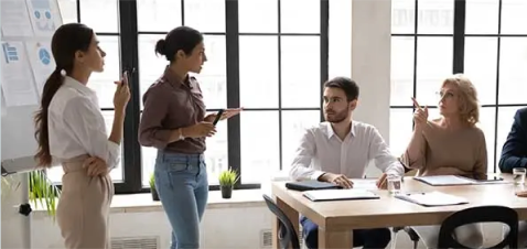 a group of people in a meeting