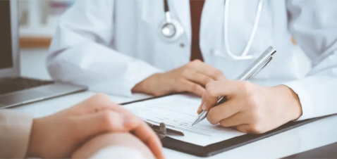 a person writing on a tablet