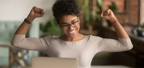 a woman with her arms raised