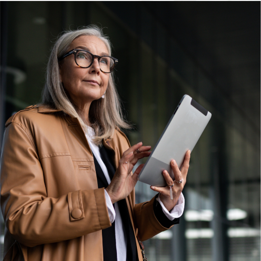 a woman sitting at a table with a laptop