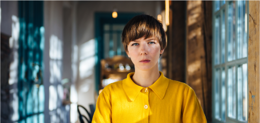 a woman in a yellow shirt