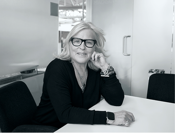 smiling women sitting at desk in the office